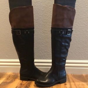 Black and brown knee high boots